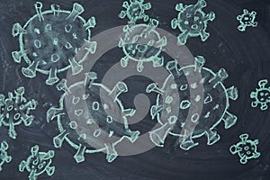 Outbreak Warning. written white chalk on blackboard in connection with epidemic of coronavirus worldwide