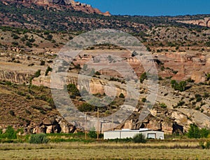 Outbuilding Beneath Red Cliffs