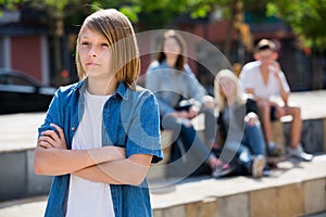 Outcasted teenage boy outdoors