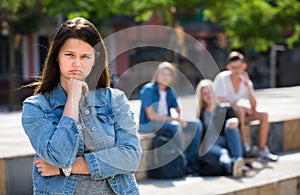 Outcasted teenage girl outdoors