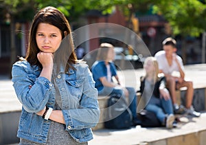 Outcasted teenage girl outdoors