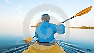 Outdoor activities during quarantine, man paddles kayak alone, self-isolation