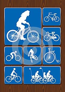 Outdoor activity icons set: woman on bicycle, cycling, family on walk, old bicycle. Icons in blue color on wooden background