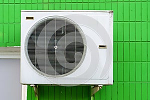 Outdoor air conditioning unit. A large modern air conditioner on the wall of an apartment building. Repair and maintenance of the
