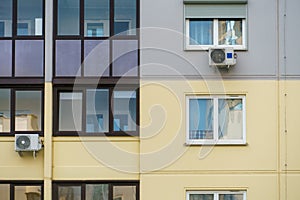 Outdoor air conditioning unit. A large modern air conditioner on the wall of an apartment building. Repair and maintenance of the