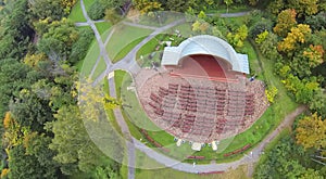 Outdoor amphitheater in autumn park. View from photo