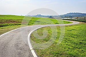 Outdoor asphalt road, exercise bike paths on the hill