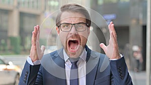 Outdoor Attractive Young Businessman Screaming, Shouting