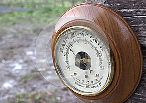 Outdoor barometer pointing to rain