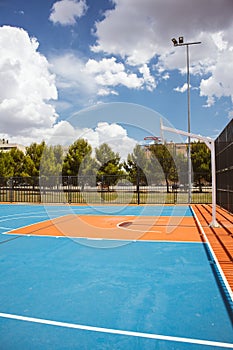 Outdoor basketball court Blue red playground for sports. Ecological flooring.