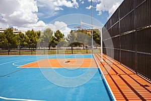 Outdoor basketball court Blue red playground for sports. Ecological flooring.