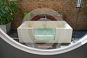 Outdoor bathtub for honeymoon in sexy bathroom hotel