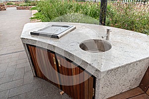 Outdoor bbq and sink on top of apartment block