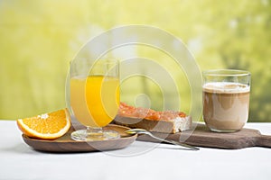 outdoor breakfast with espresso and fresh orange juice