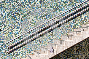 Outdoor building stair. Mosaic colourful wall. Building structure