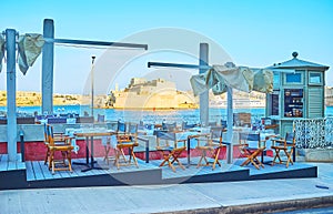 Outdoor cafe in Barriera Wharf, Valletta, Malta photo