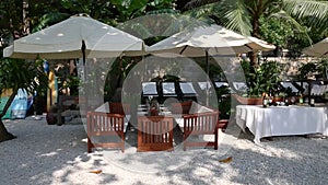 Outdoor cafe on beach ready welcoming guests.