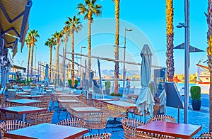 The outdoor cafe at Muelle Uno promenade, Malaga Port, Spain