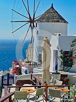 Outdoor Cafe and Traditional Windmill, Oia, Santorini, Greece