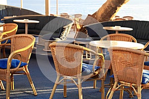 Outdoor cafe with wicker chairs