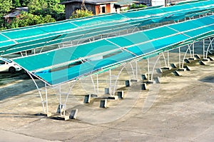 Outdoor car parking with shelter net