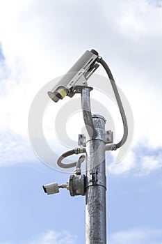 Outdoor CCTV Camera on the Pole with Blue Sky