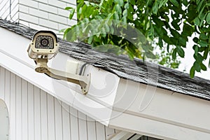 Outdoor CCTV security camera installed at house loof