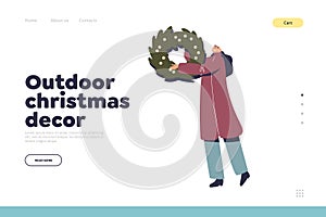 Outdoor Christmas decoration concept of landing page with woman hold xmas wreath