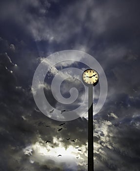 Outdoor clock and cloudy sky