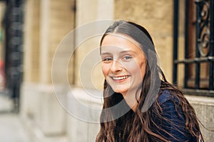 Outdoor close up portrait of pretty teenage girl