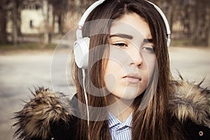 Outdoor close up portrait of a pretty teenage girl