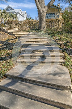 Outdoor concrete steps in San Antonio Texas along beautiful houses and trees