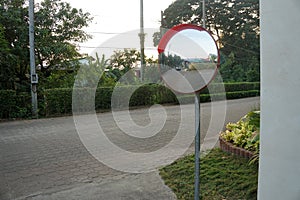 Outdoor convex mirrors. Traffic curved glass. Large convex mirror on the road to improve visibility. Convex mirrors for roadside s