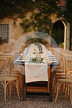Outdoor courtyard wedding dinner set up Tuscany  Italy.