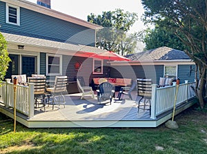Outdoor Deck With Table, Chairs, and Umbrella
