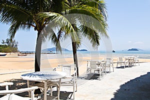 Outdoor dining tables nearby beach