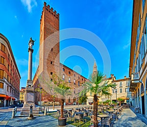 Outdoor dinings and Palazzo del Comune on Piazza della Pace, Cremona, Italy