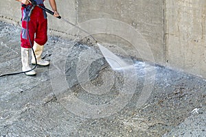 Outdoor dirty concrete cleaning with high pressure water