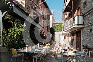 Outdoor eating of a restaurant or cafe in Taormina, Sicily. Table setting for dining