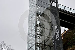 an outdoor elevator with a glass structure can be added