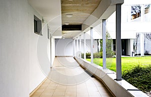 outdoor empty corridor with garden in the modern office building