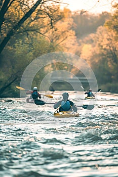 Outdoor enthusiasts engaging in water sports like kayaking and rafting.