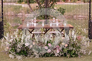 outdoor event, white chairs and tables placed outside