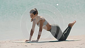 Outdoor Exercising of Sporty Woman on the Beach.