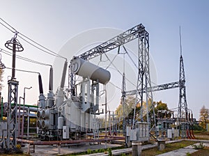 The outdoor extra high voltage power transformer. A high-voltage power electrical substation