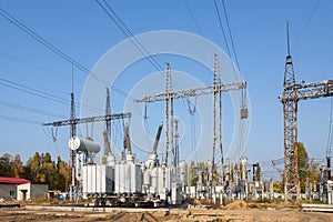 The outdoor extra high voltage power transformer. A high-voltage power electrical substation