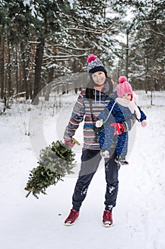 Outdoor family activities for happy christmas winter holidays. Happy father and mother playing with little baby toddler