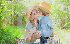 Outdoor family leisure. Mother and child at spring picnic. Happy summer at park.