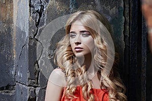 Outdoor fashion beautiful young woman photo near old HOMESTEAD summer. Portrait girl blondes in red dress. photo