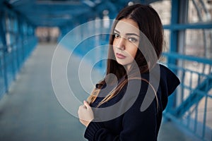 Outdoor fashion lifestyle portrait of pretty young girl, wearing in hipster swag grunge style urban background. Tomboy city